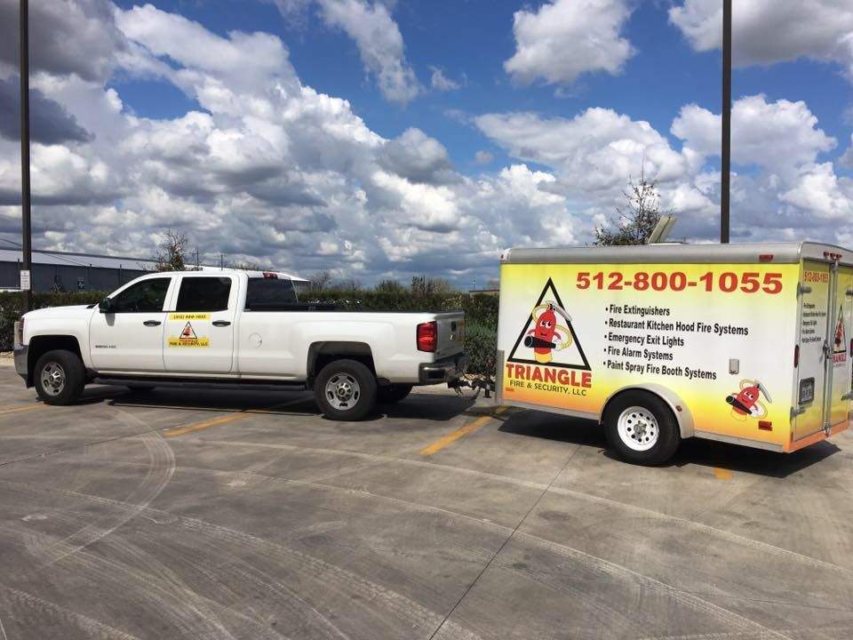 White pickup truck towing a trailer with