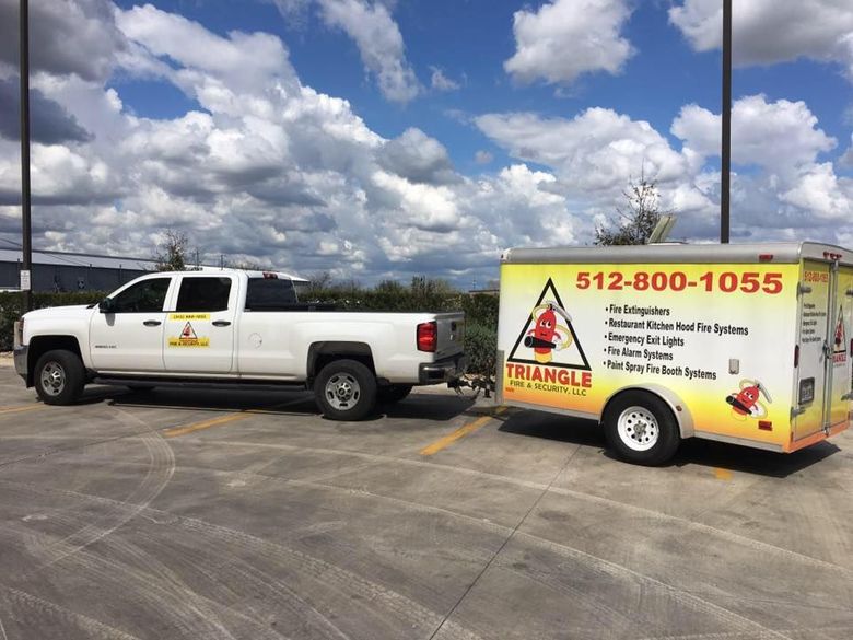White pickup truck towing a trailer with