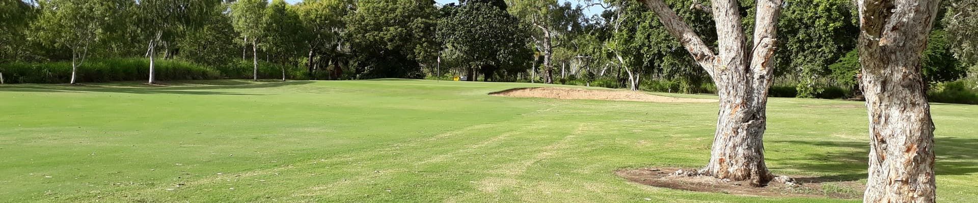 A Lush Green Field With Trees In The Background — Rowes Bay Golf Club In Rowes Bay, QLD