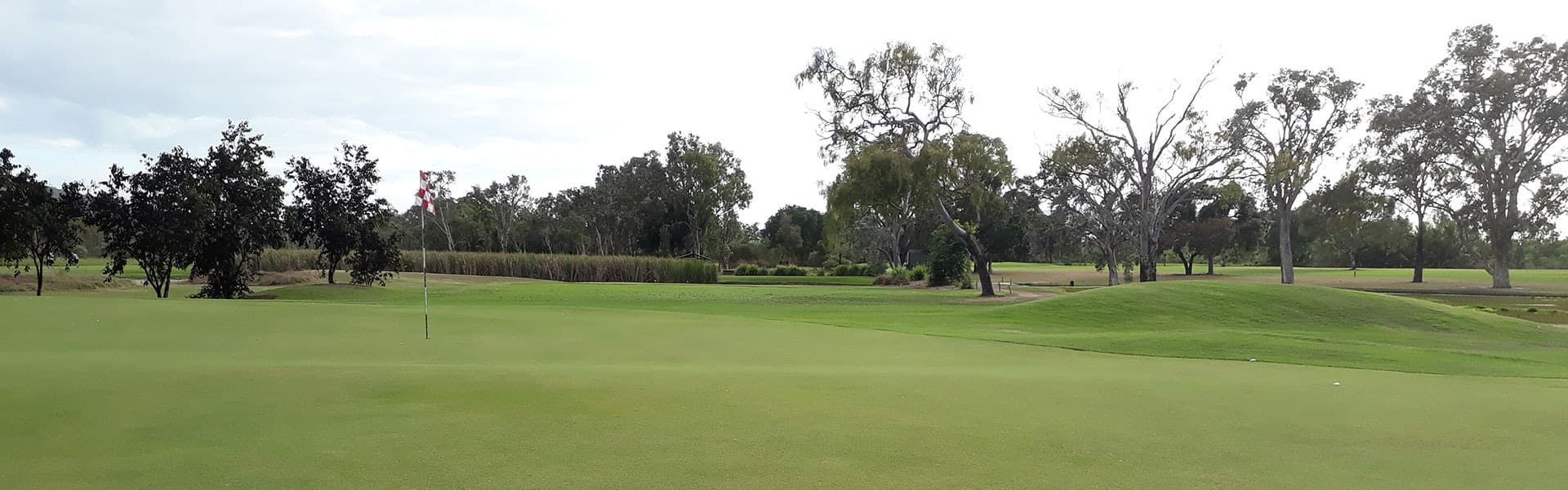 A Golf Course With A Green And Trees In The Background — Rowes Bay Golf Club In Rowes Bay, QLD