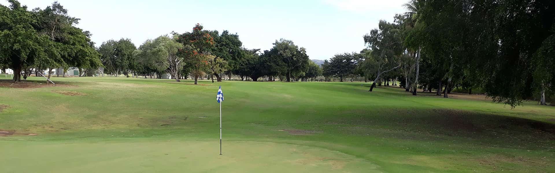 A Golf Course With A Green And Trees In The Background — Rowes Bay Golf Club In Rowes Bay, QLD