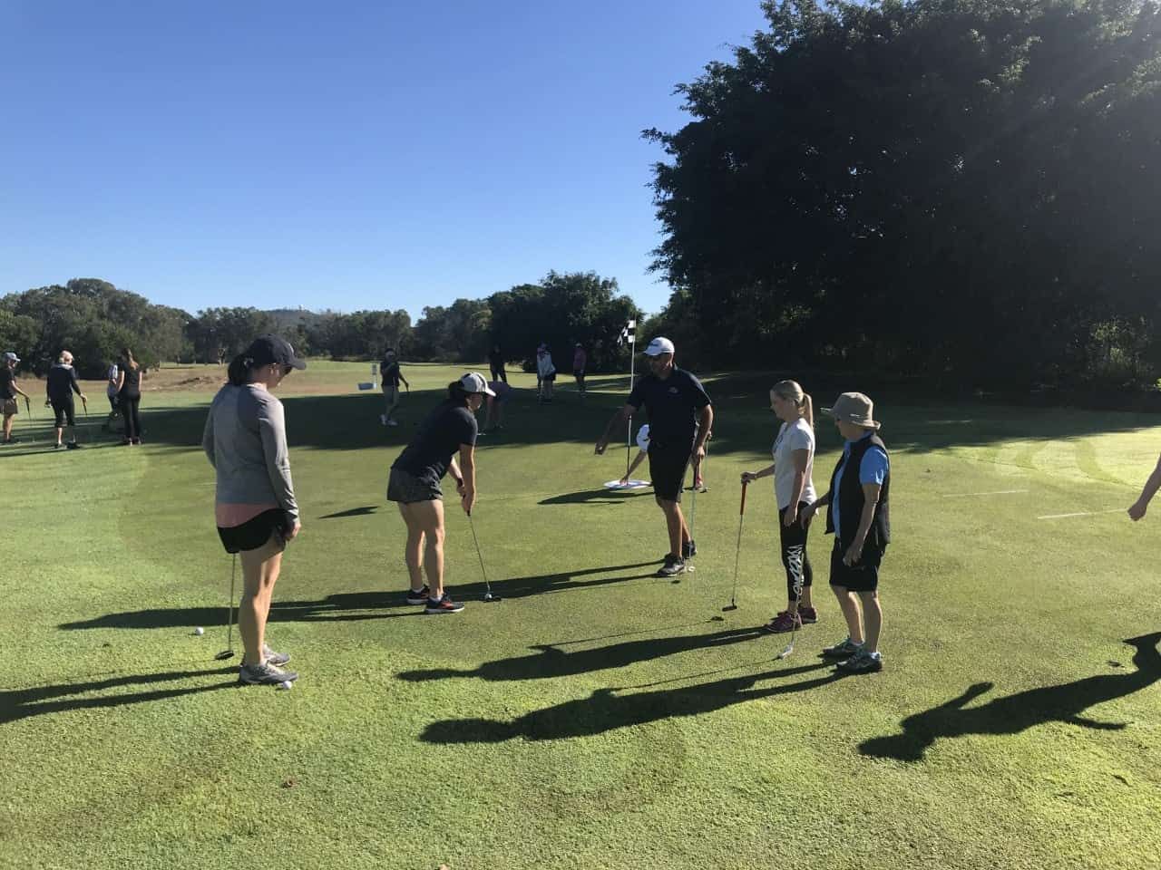 A Group Of People Are Playing Golf On A Golf Course — Rowes Bay Golf Club In Rowes Bay, QLD