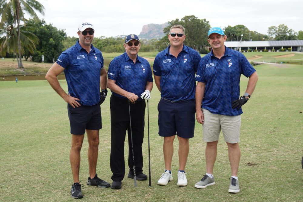 A group of men are standing on a golf course holding golf clubs — Rowes Bay Golf Club In Rowes Bay, QLD
