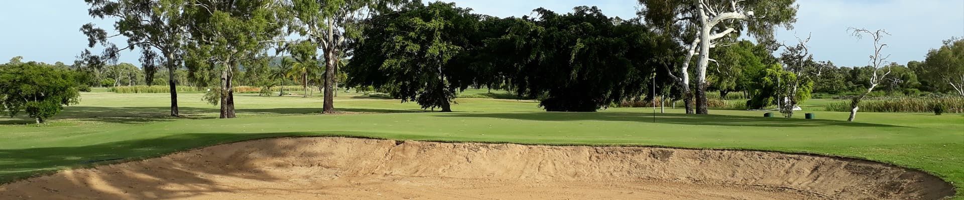 A Bunker On A Golf Course With Trees In The Background — Rowes Bay Golf Club In Rowes Bay, QLD