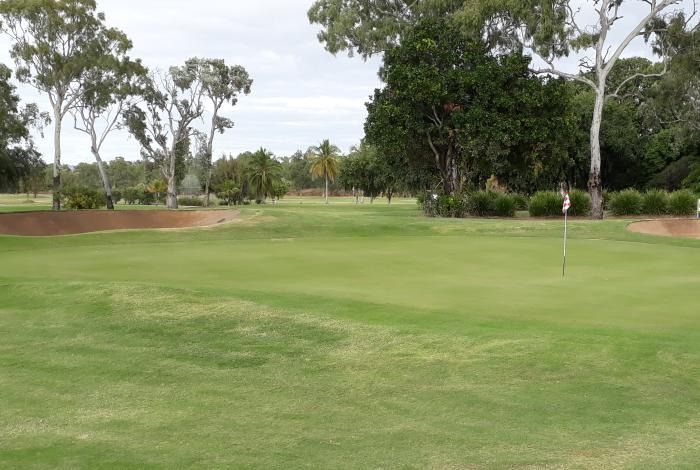 A Golf Course With A Green And Trees In The Background — Rowes Bay Golf Club In Rowes Bay, QLD