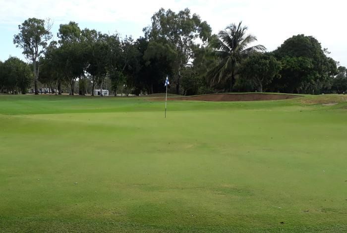 A Golf Course With A Green And Trees In The Background — Rowes Bay Golf Club In Rowes Bay, QLD