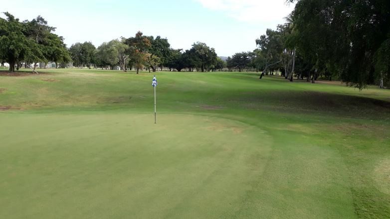 A Golf Course With A Green And Trees In The Background — Rowes Bay Golf Club In Rowes Bay, QLD