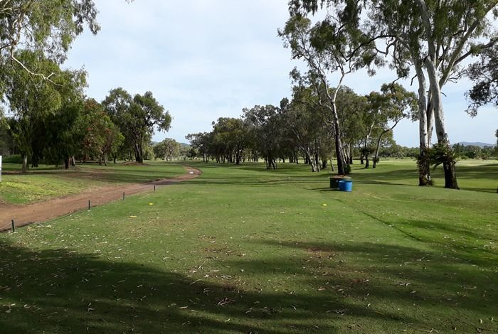 A Golf Course With Trees And A Blue Barrel In The Middle — Rowes Bay Golf Club In Rowes Bay, QLD