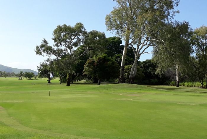A Golf Course With A Green And Trees In The Background — Rowes Bay Golf Club In Rowes Bay, QLD