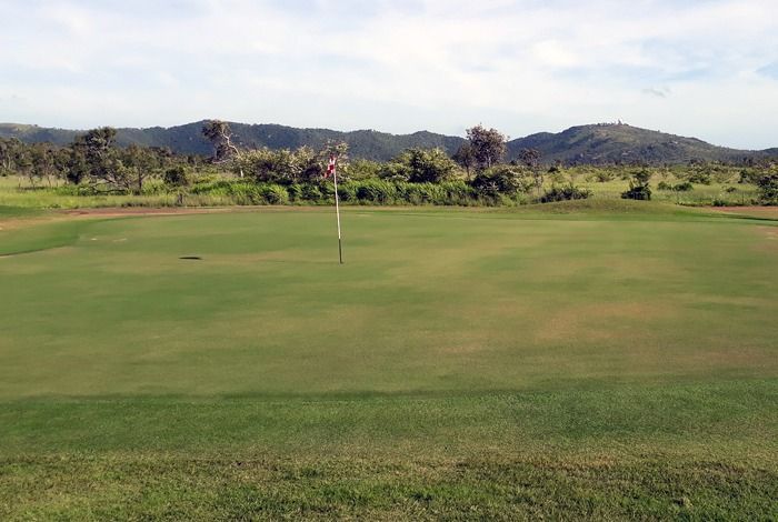 A Green Golf Course With Mountains In The Background — Rowes Bay Golf Club In Rowes Bay, QLD