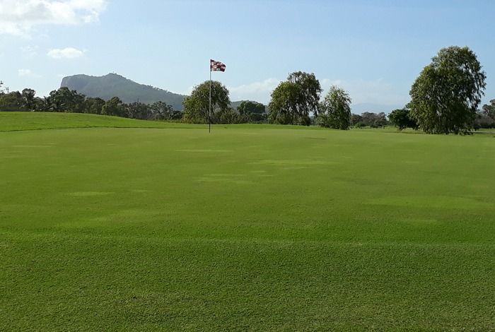 A Golf Course With A Flag In The Middle Of It — Rowes Bay Golf Club In Rowes Bay, QLD