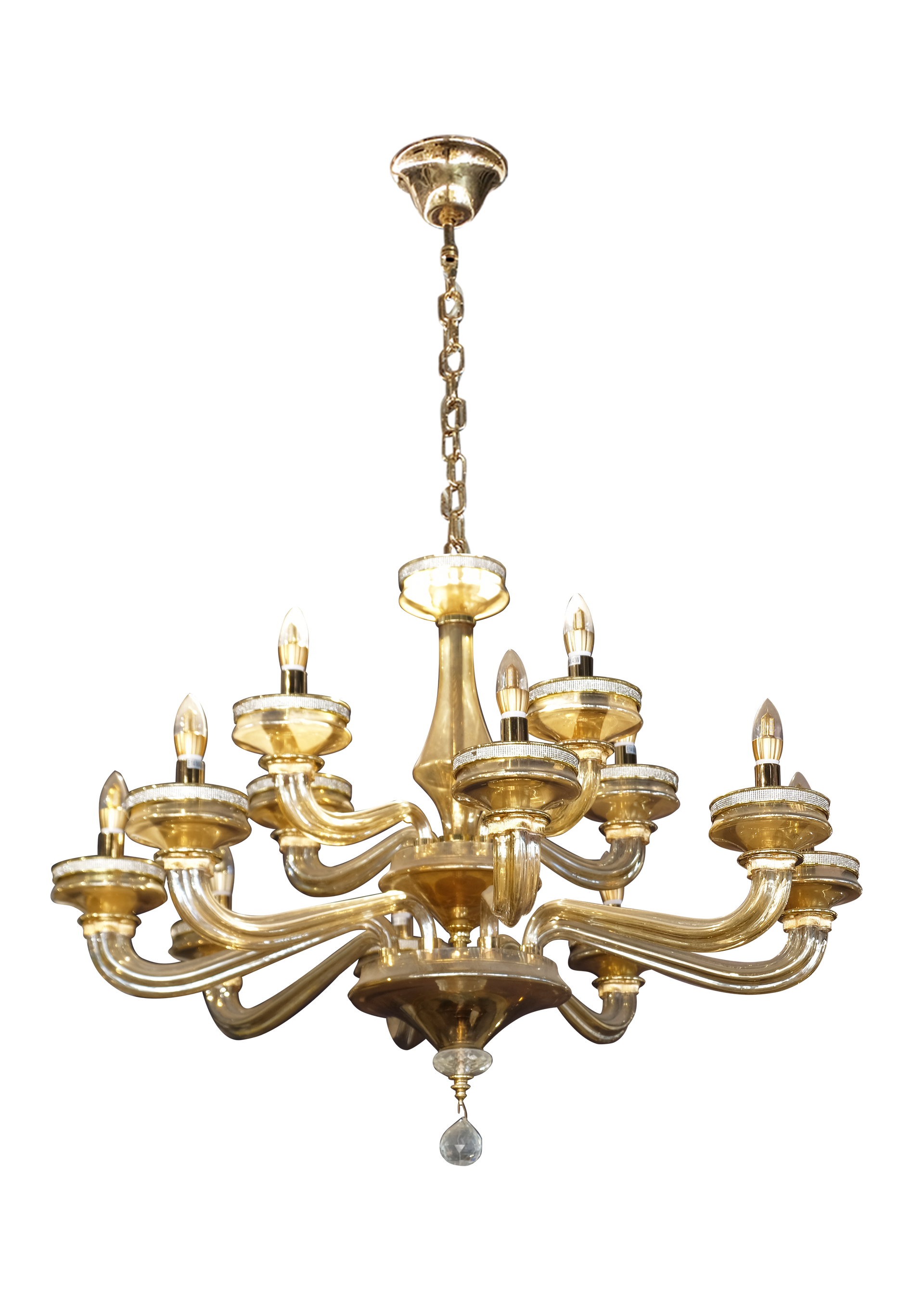 A brass chandelier with candles hanging from the ceiling on a white background.