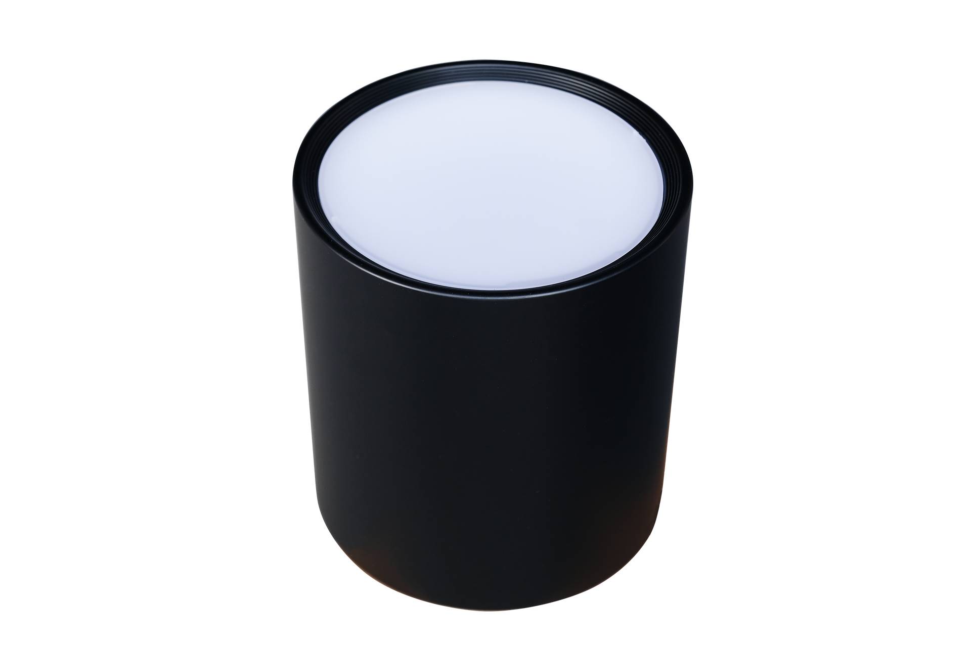 A black cylinder with a white light inside of it on a white background.