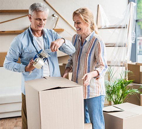 Senior Couple Packing Boxes — Vienna, VA — Fairfax Estate Sales TFV