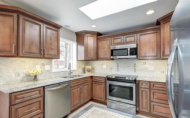 Kitchen with Wooden Cabinets — Vienna, VA — Fairfax Estate Sales TFV