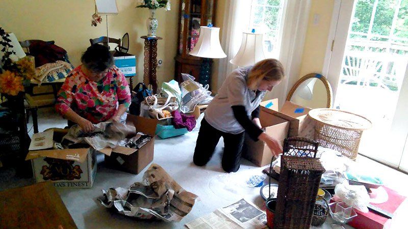 Two Woman Arranging Donations — Vienna, VA — Fairfax Estate Sales TFV