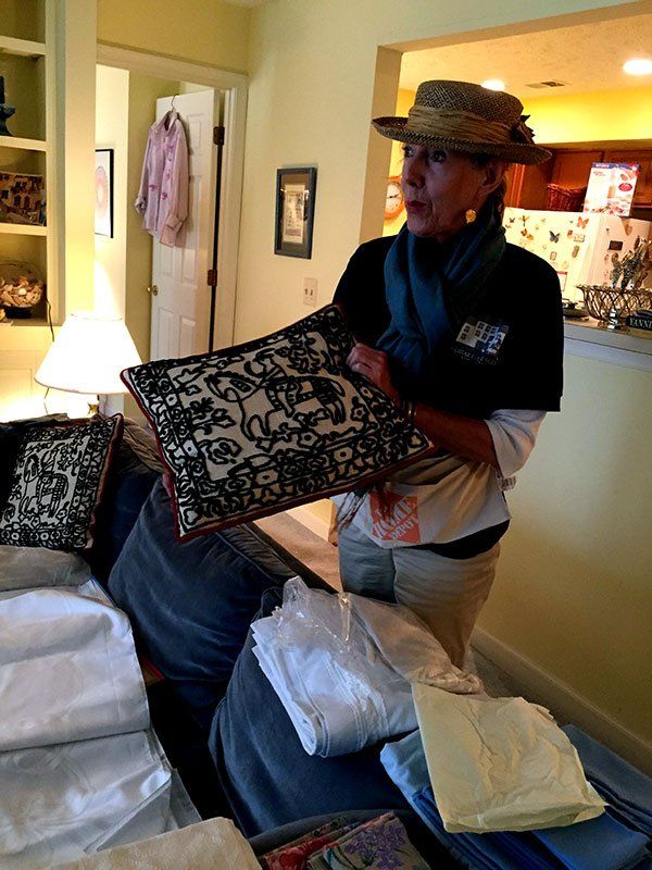 Woman Holding a Pillow — Vienna, VA — Fairfax Estate Sales TFV