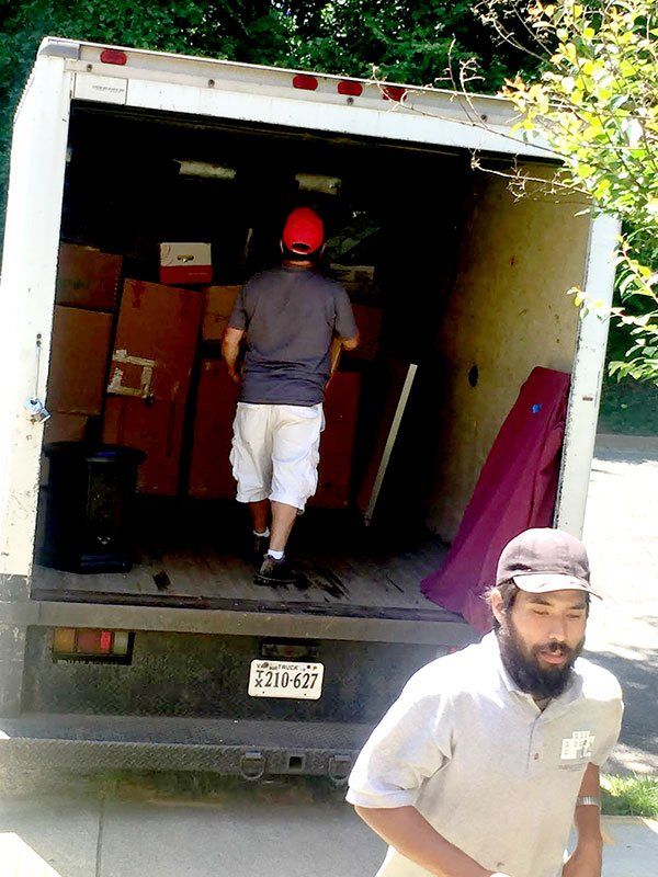 Man Loading Boxes in Truck — Vienna, VA — Fairfax Estate Sales TFV
