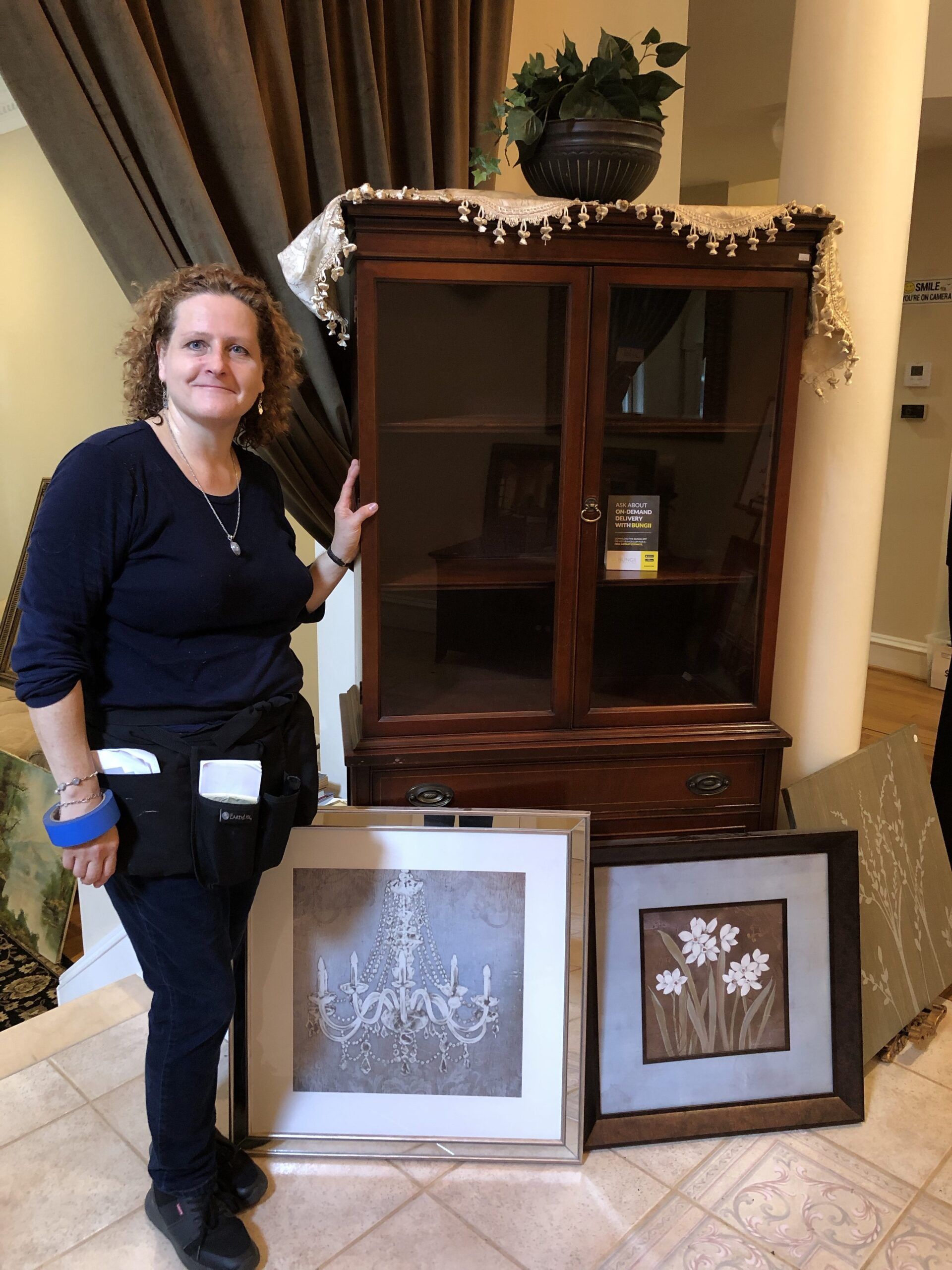 Woman with Cabinet and Frames — Vienna, VA — Fairfax Estate Sales TFV