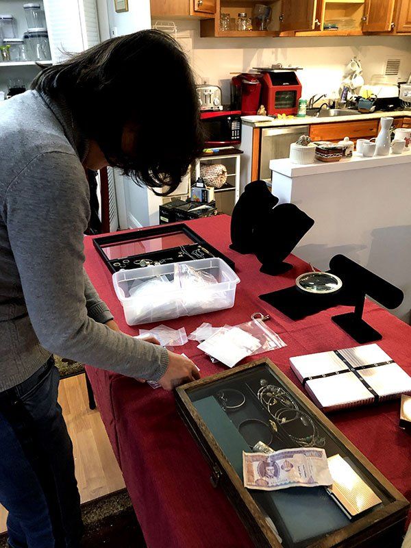 Woman Arranging Jewelries — Vienna, VA — Fairfax Estate Sales TFV