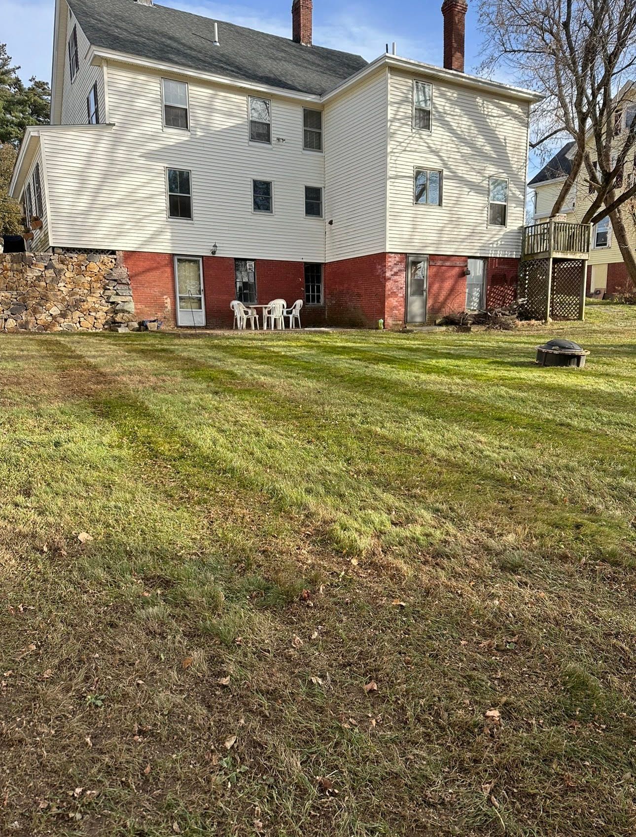 a large house with a lot of grass in front of it .