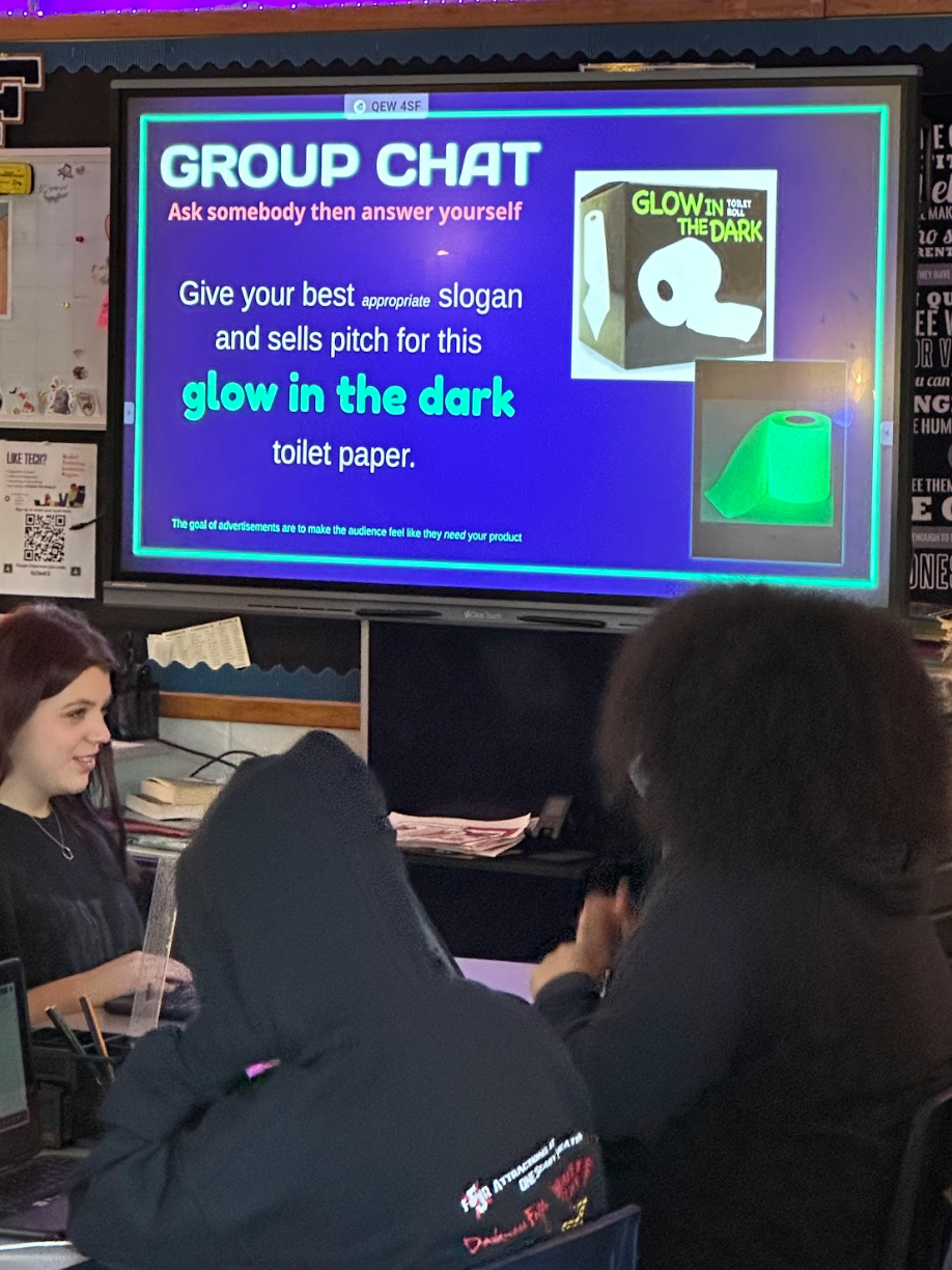 A group of people are sitting in front of a group chat screen