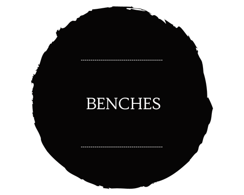 Black circular sign with the word “BENCHES” in white text