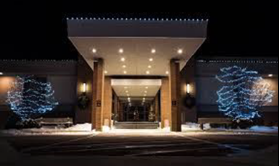 a commercial building with permanent holiday lights