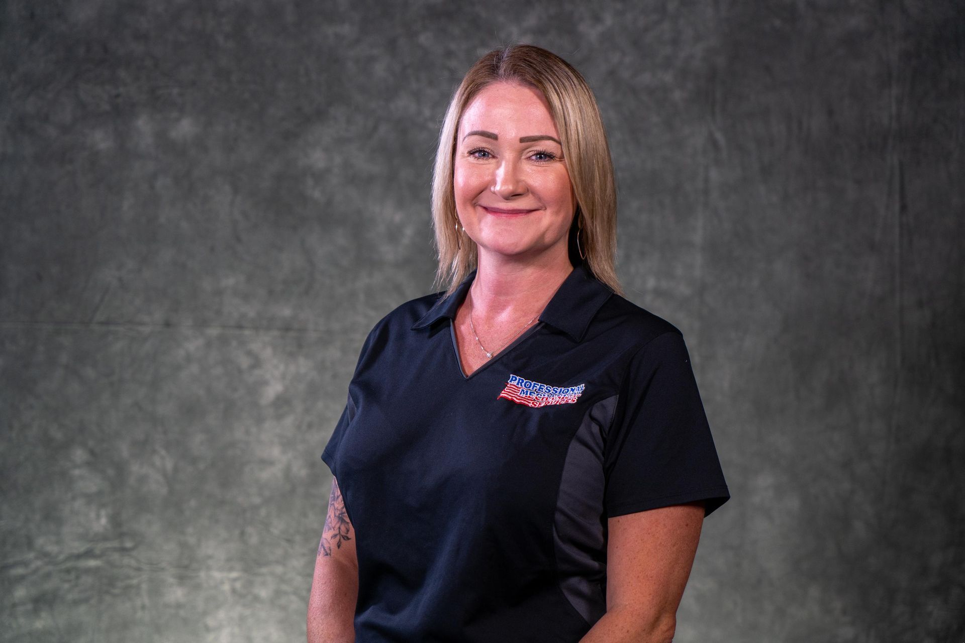 A woman wearing a black shirt with an american flag on it