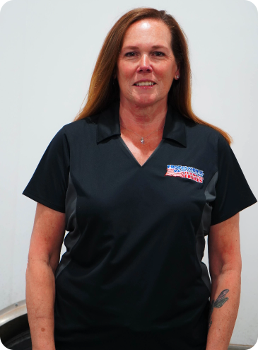 A woman wearing a black shirt that says warriors on it