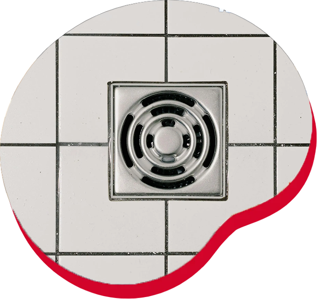 Square metal shower drain surrounded by white tiles with black grout; red curve at the edge.