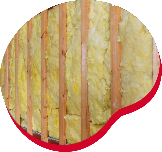 Yellow insulation between wooden studs.