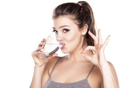Woman Drinking Water -  Water filtration in Central NY