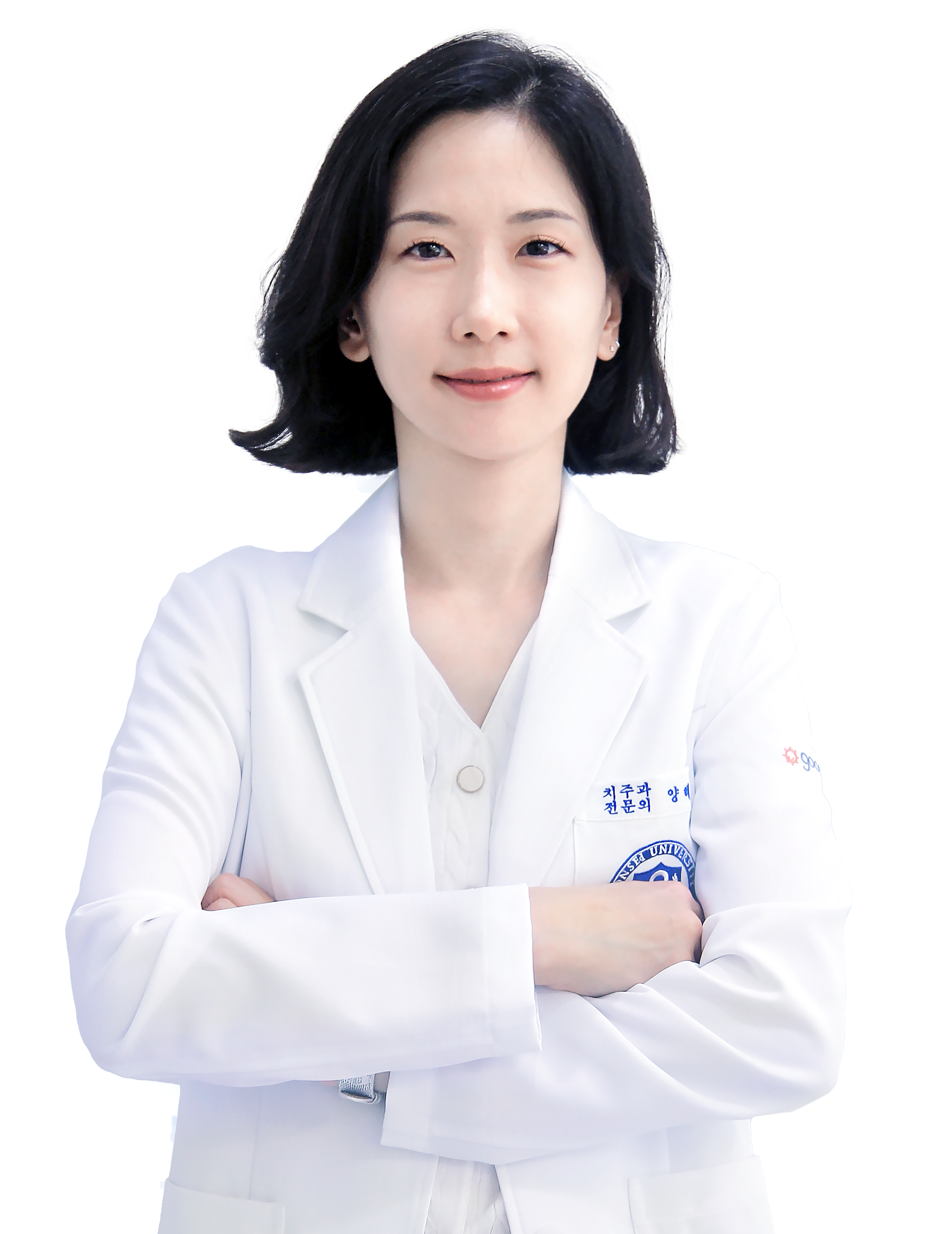 Woman in a white lab coat, arms crossed, smiling. Likely a doctor or medical professional.