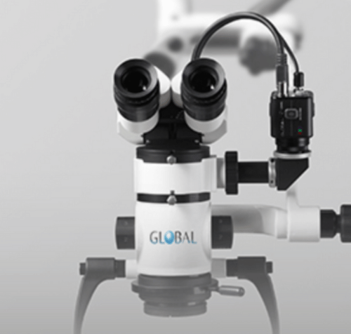 Dental surgical microscope with dual eyepieces, a camera, and the