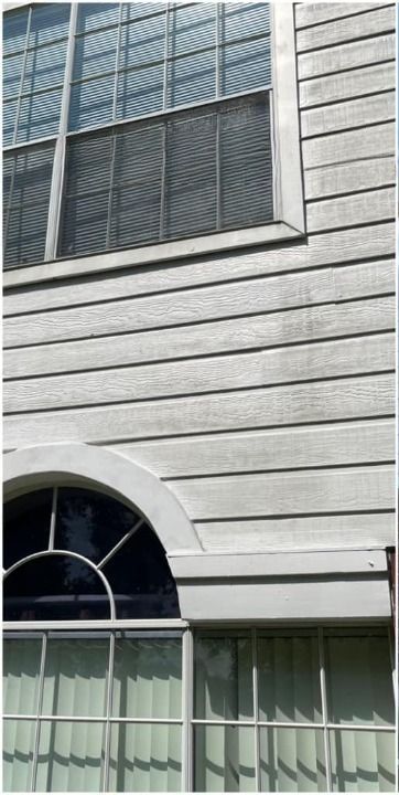 A close up of a window on a white house