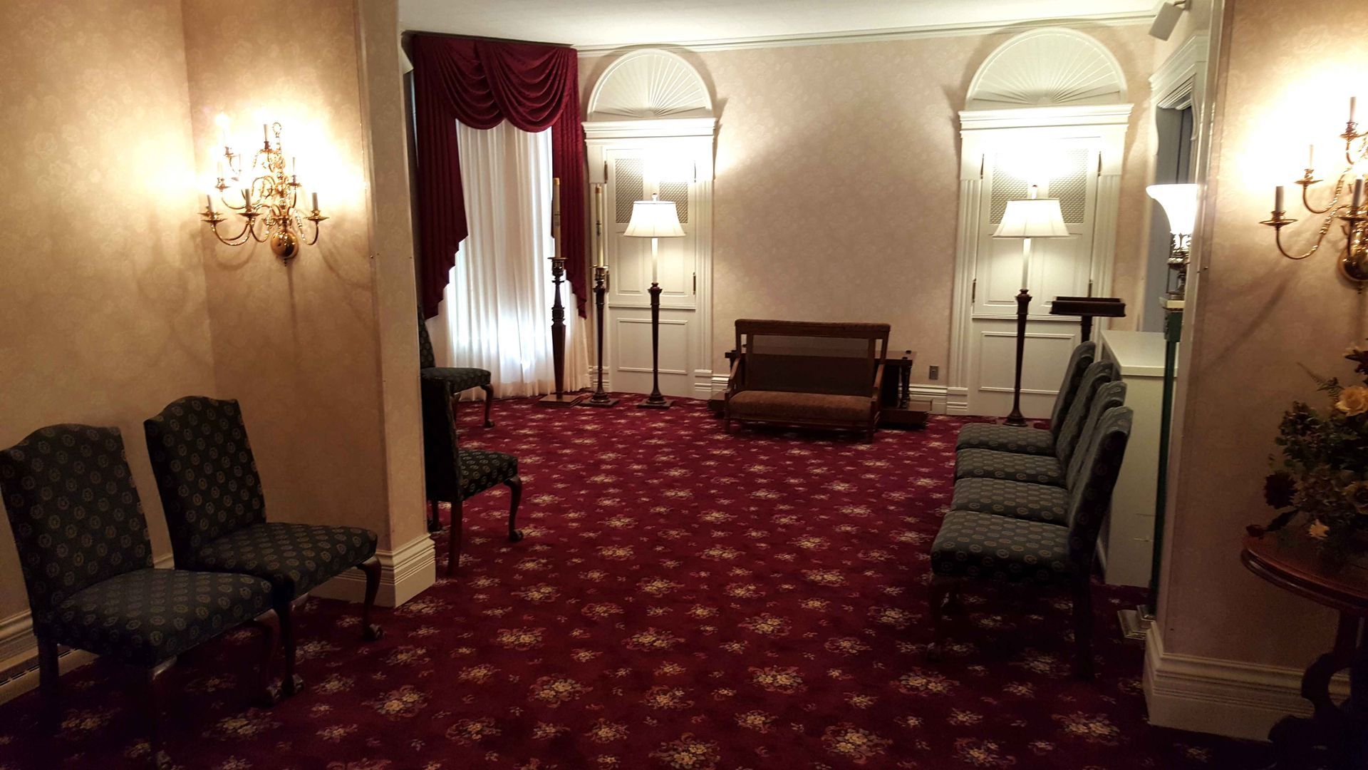 A room with chairs and a couch in it