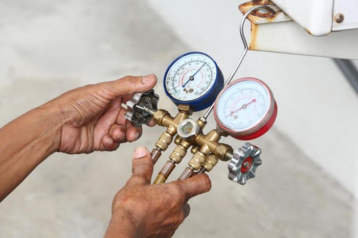 worker adjusting the gauge