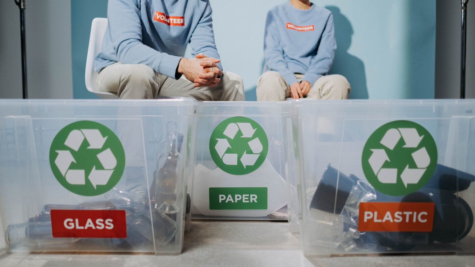 Two people doing recycling