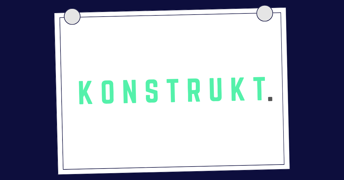 Four people in an office looking at papers on a table, discussing work.