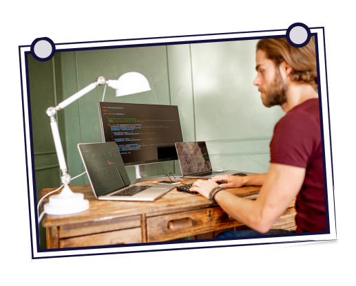 Person typing on laptop with Google search open, coffee cup on table.