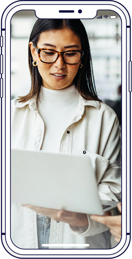 Teacher with students in a classroom. Interactive whiteboard, desks, light colors.
