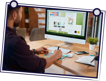 Group of people in meeting around table, one person presenting with paper. Modern office setting.