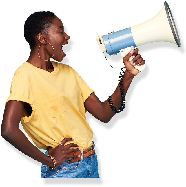 Woman yelling into a blue and white megaphone. She wears a yellow shirt and jeans, hand on hip.