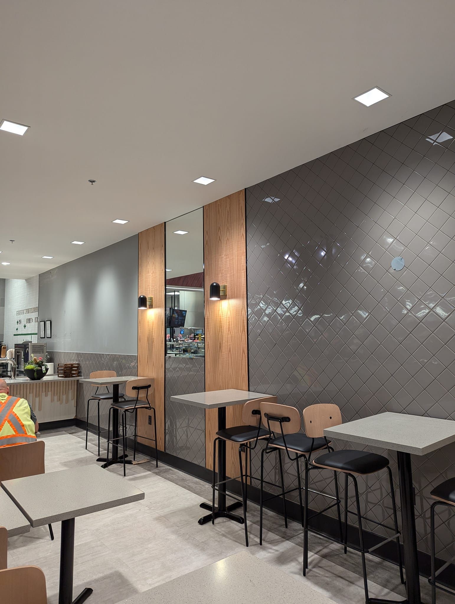 A rendering of a restaurant with tables and chairs.