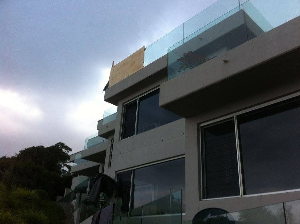 A Large House With Lots of Windows and a Balcony — Kincumber Glass & Glazing in Kincumber, NSW