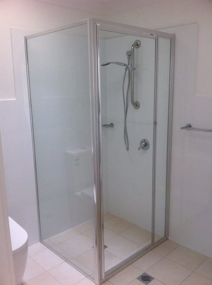 A Bathroom With a Shower Stall and a Toilet — Kincumber Glass & Glazing in Kincumber, NSW