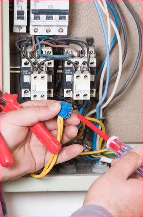  Electrician rewiring fuse box