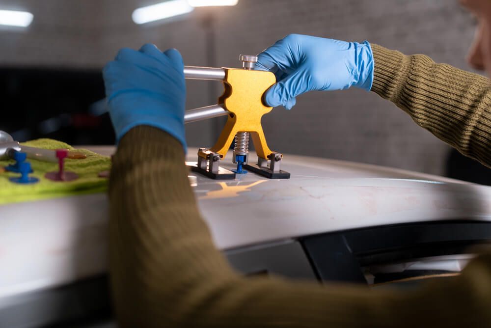 Close-up of Car Dent Removal Process — Dent Repair Specialist in Kunda Park, QLD