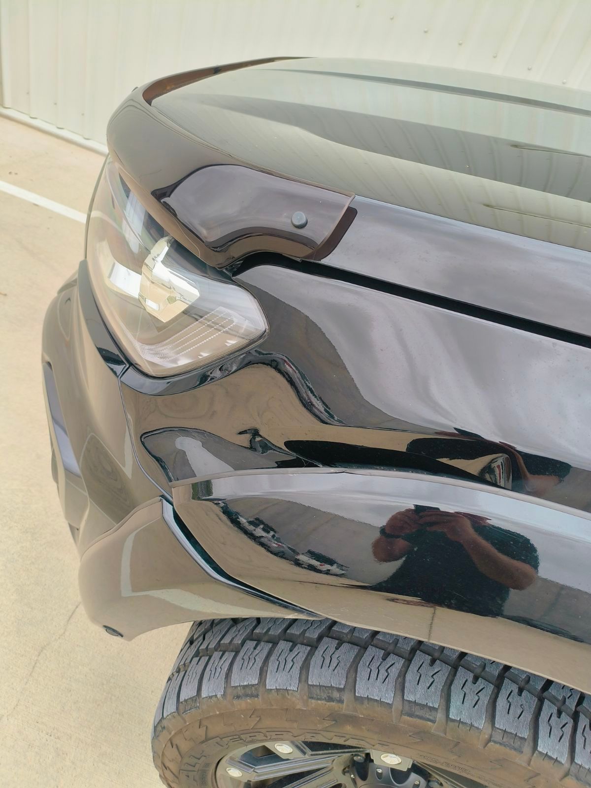 Black Car Wheel Arch With A Fixed Scratch — Dent Repair Specialist in Kunda Park, QLD